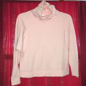 Light pink turtle neck sweater.